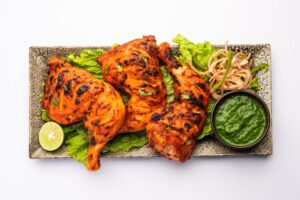 vecteezy-tandoori-chicken-is-an-indian-non-vegetarian-spicy-food-1593339111-e19c76cf1b28908665001625bb727ae6-5b833ad9c4412a331a7c468bca906658